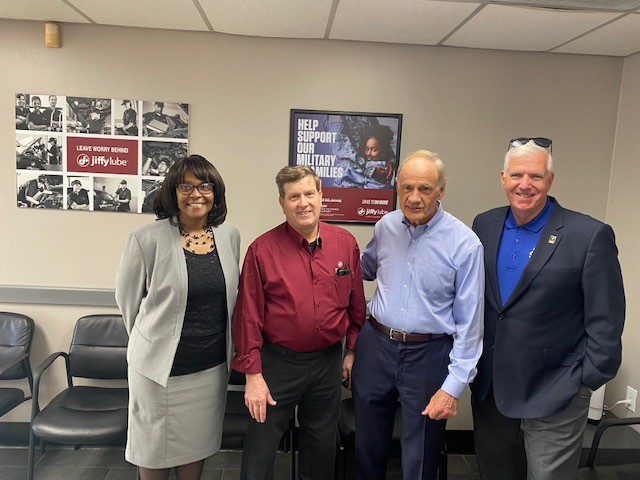 Gathered at Jiffy Lube of Lewes to mark National Veteran-Owned Small Business Week are (l-r) Michelle Harris, SBA Delaware director; Michael Soules, Jiffy Lube of Lewes owner; U.S. Sen. Tom Carper; and SBA Delaware Deputy Director Robert Piechota.